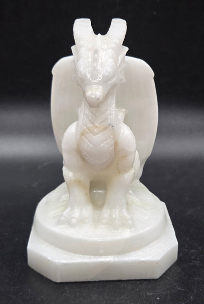 White Jade crystal dragon sculpture on a dark background