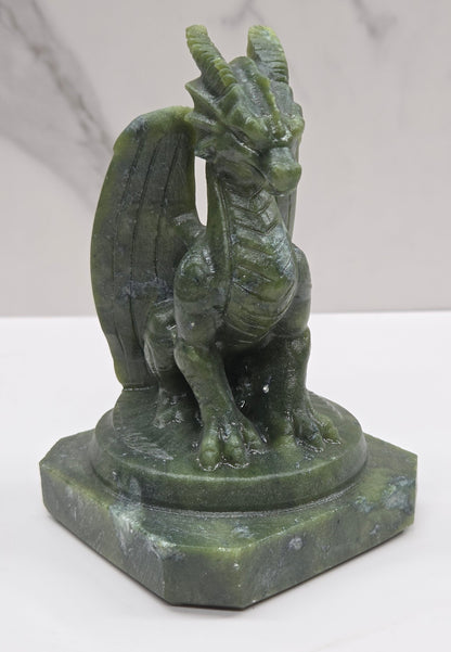 Green Jade crystal dragon sculpture on a white background