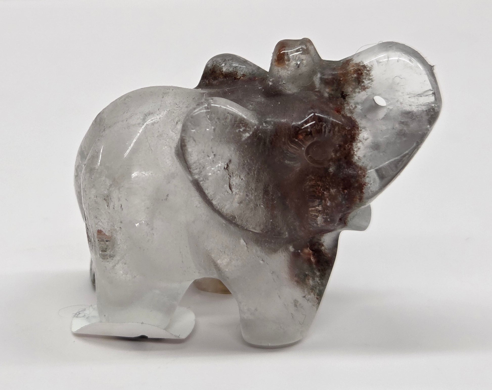 Elephant shaped garden quartz crystal carving on a white background