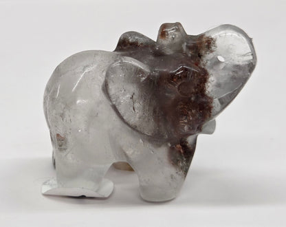 Elephant shaped garden quartz crystal carving on a white background