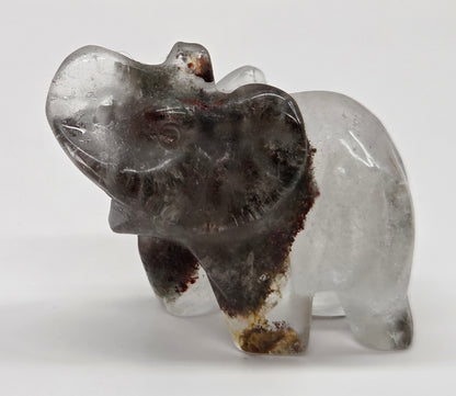 Elephant shaped garden quartz crystal carving on a white background