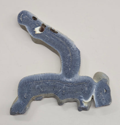 Blue Coral free form on an acrylic stand on a white background
