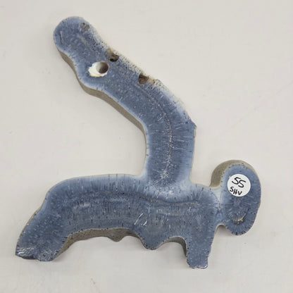 Blue Coral free form on an acrylic stand on a white background