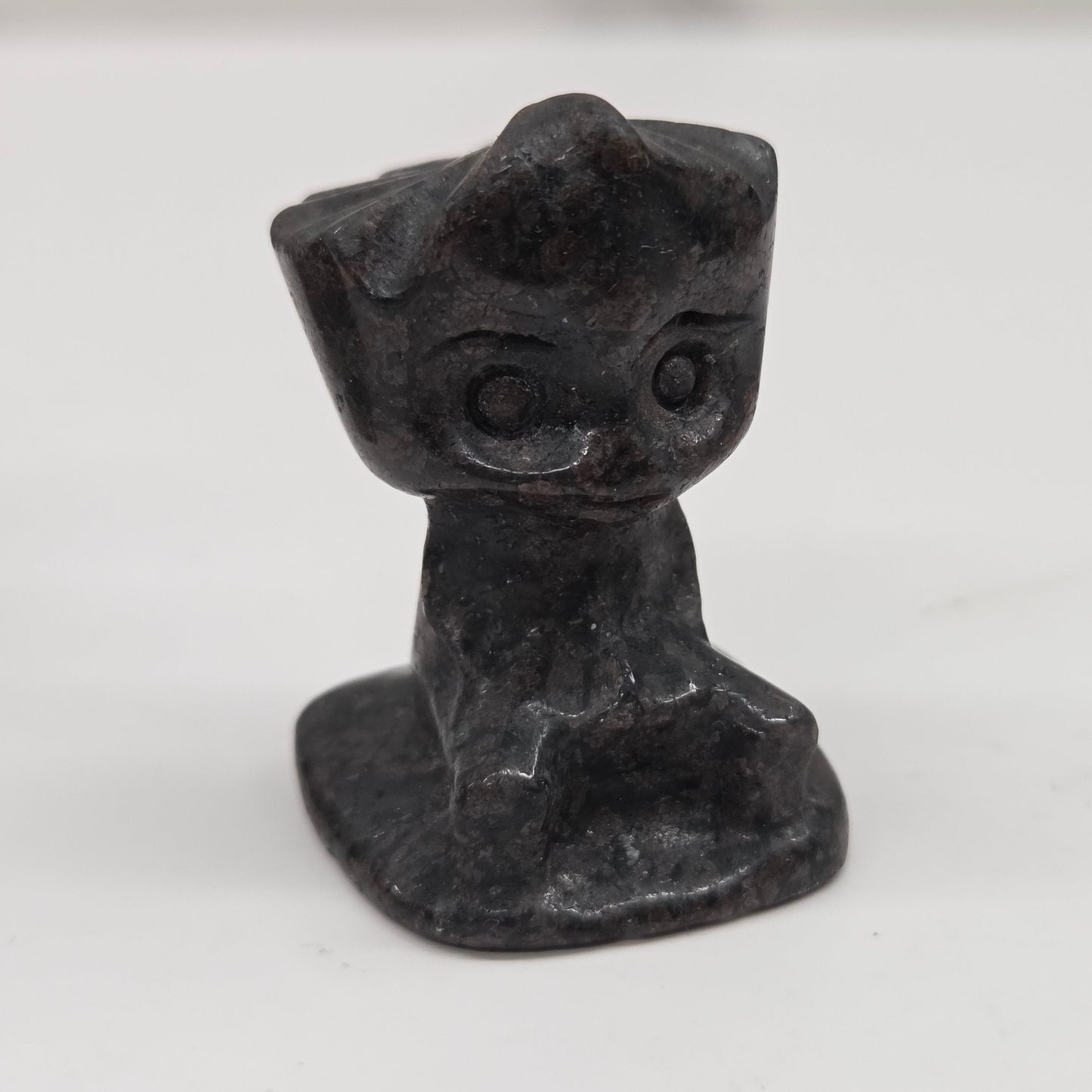 Garnet sculpture of Groot on a white background