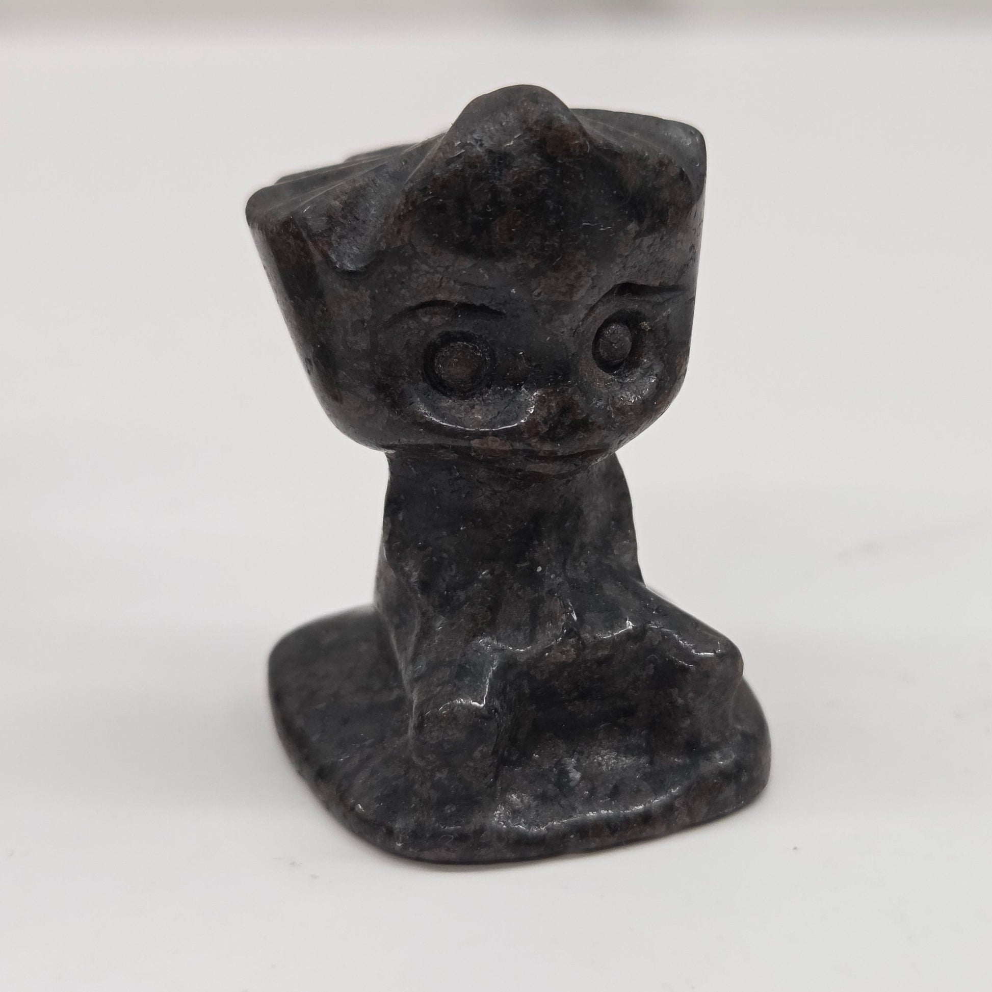 Garnet sculpture of Groot on a white background
