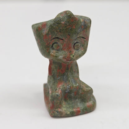 Unakite sculpture of Groot on a white background