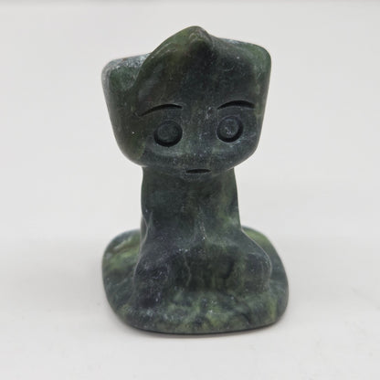 Green Jade sculpture of Groot on a white background