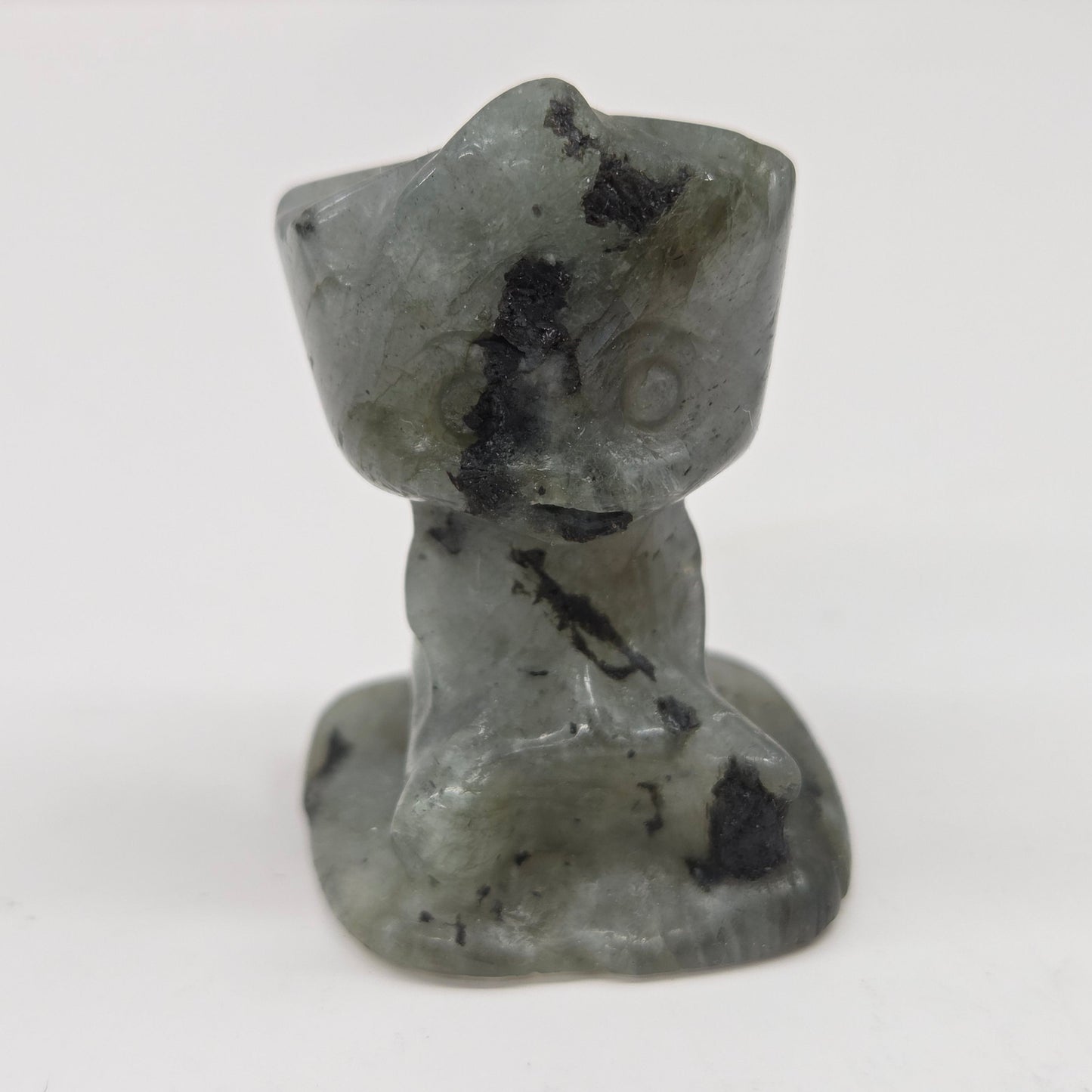 Labradorite sculpture of Groot on a white background