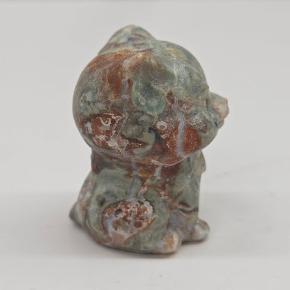 Small Money Agate cat figurine on a white background
