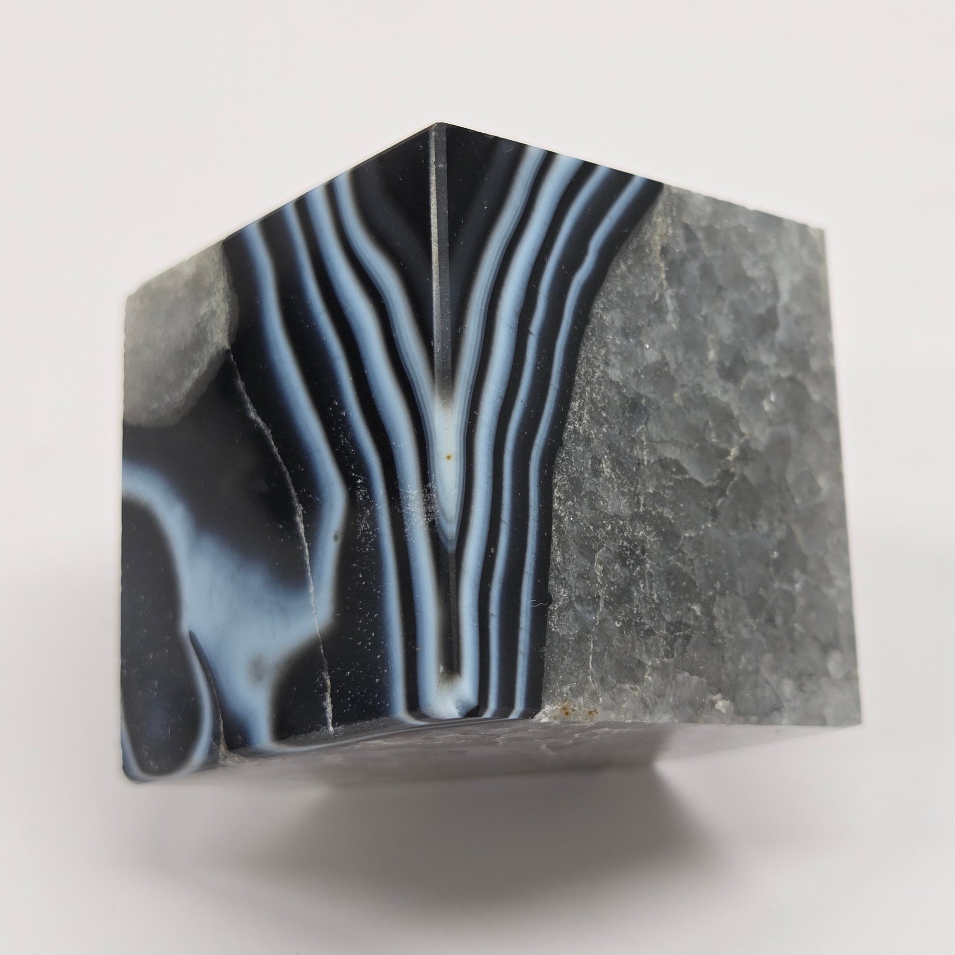 Black Agate cube shape with black and white banding and quartz on a white background