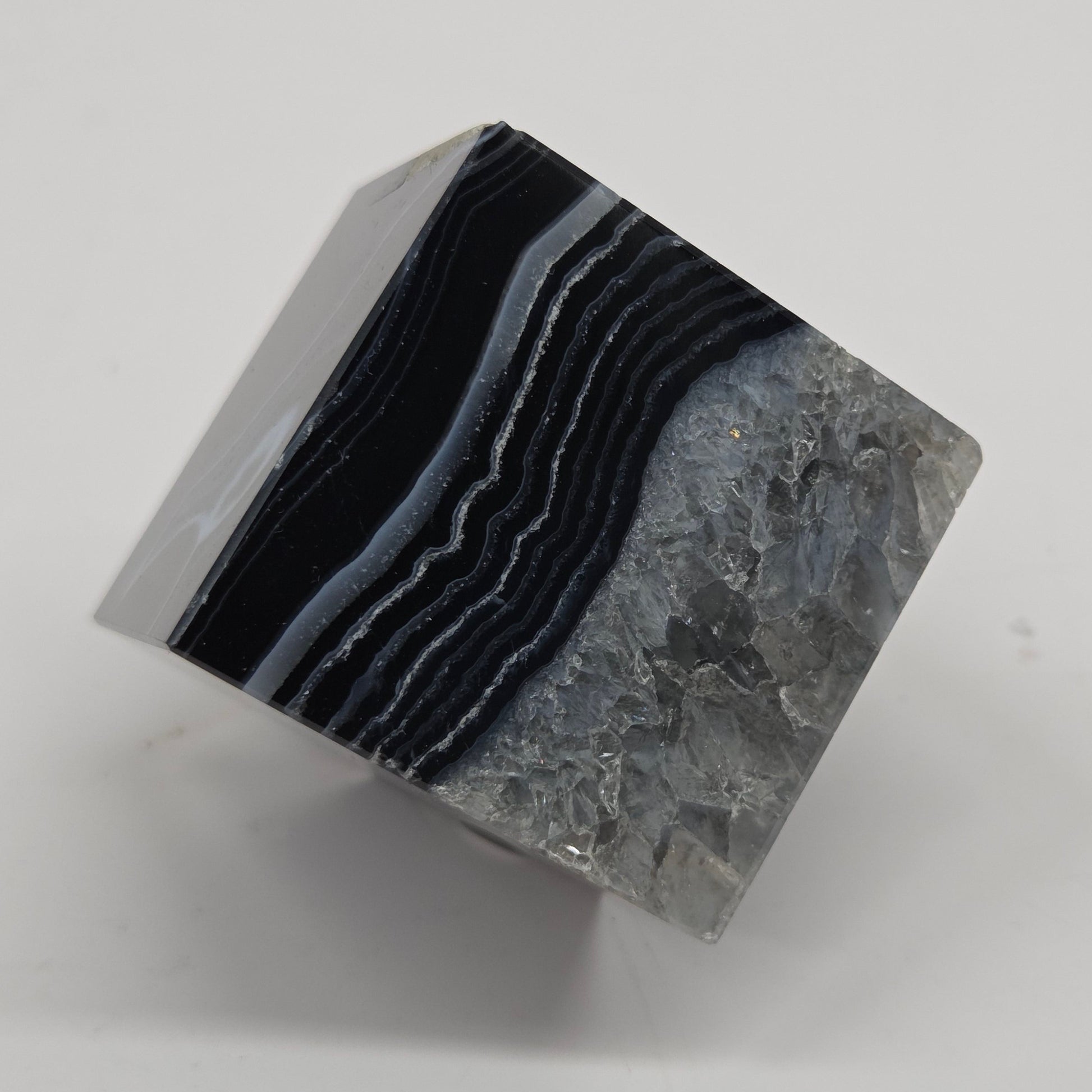 Black Agate cube shape with black and white banding and quartz on a white background