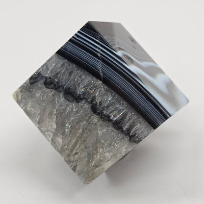 Black Agate cube shape with black and white banding and quartz on a white background
