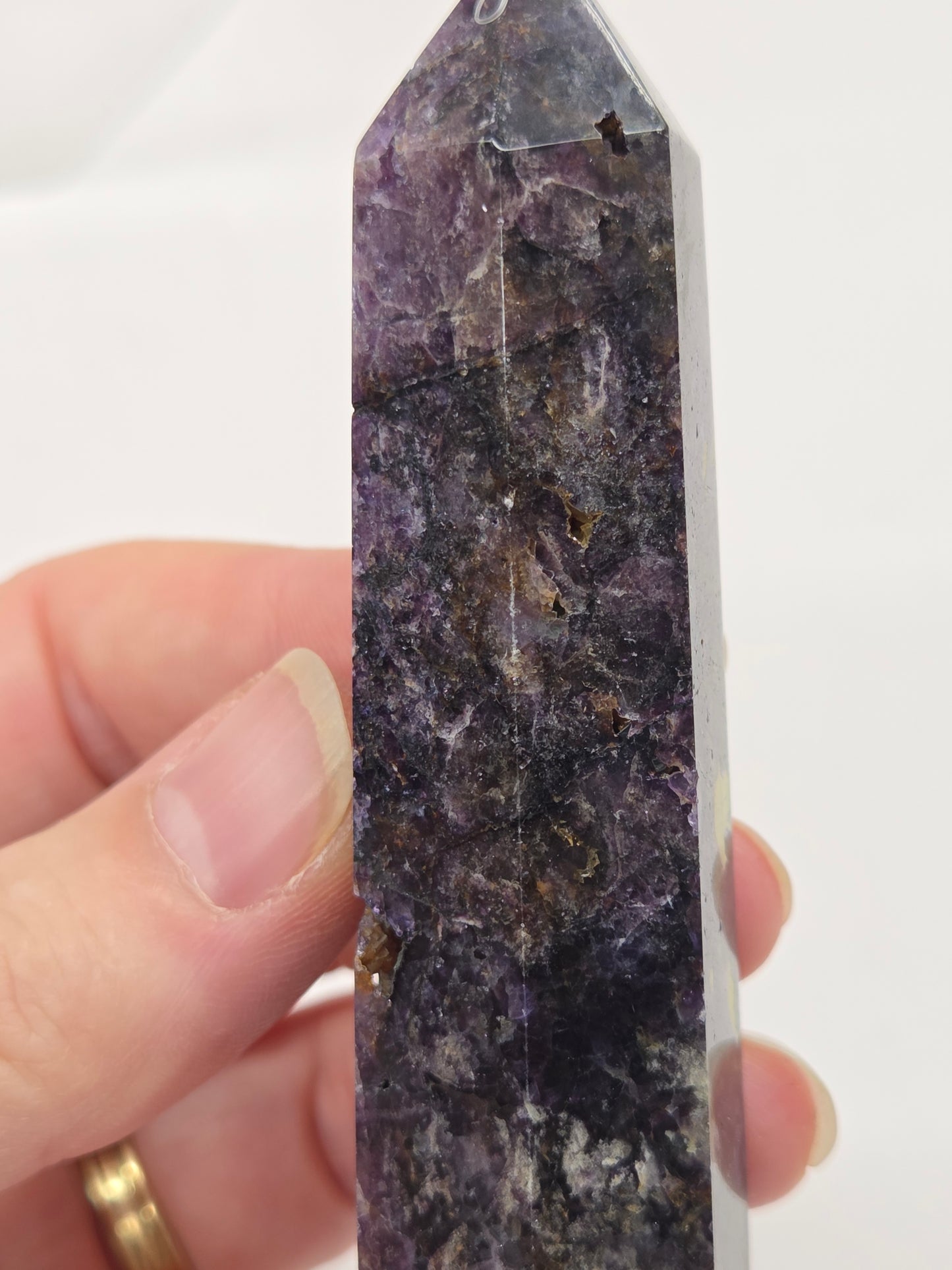 Brecciated Fluorite tower against a white background