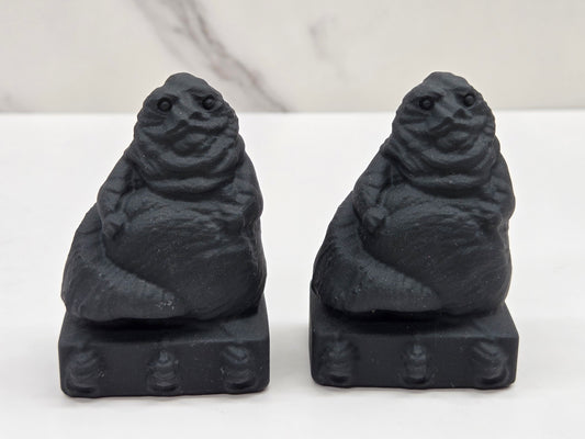 Obsidian Jabba the Hut, from Star Wars, carvings on a white background