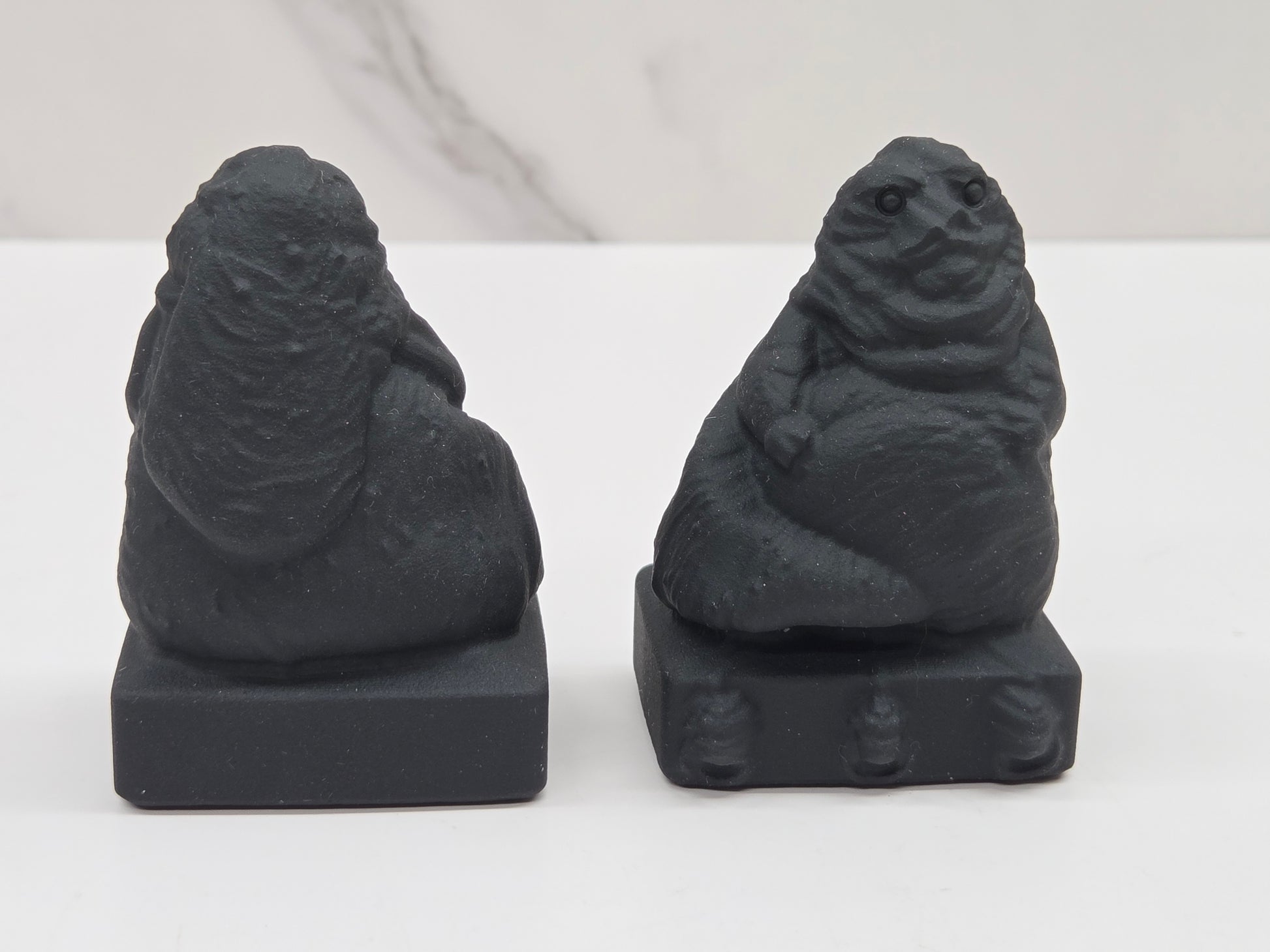 Obsidian Jabba the Hut, from Star Wars, carvings on a white background