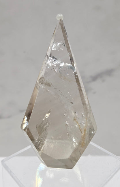 Smoky Quartz crystal object on a marble surface