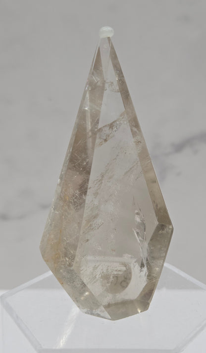 Smoky Quartz crystal object on a marble surface