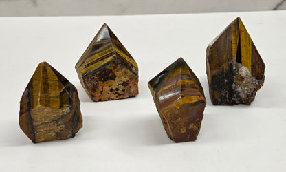 Tiger eye crystals on a white surface with a marble background