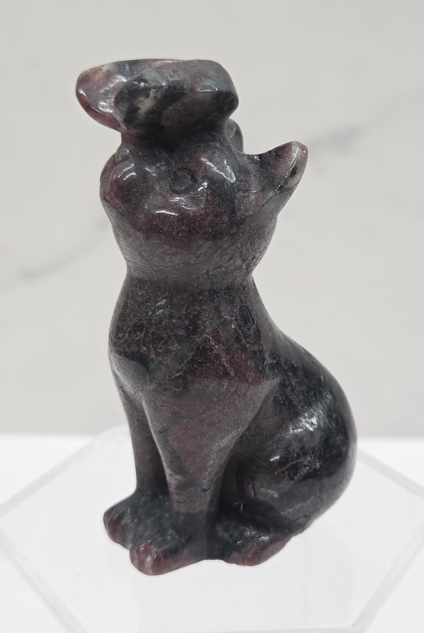 Garnet crystal cat-shaped carving with a butterfly on the nose.