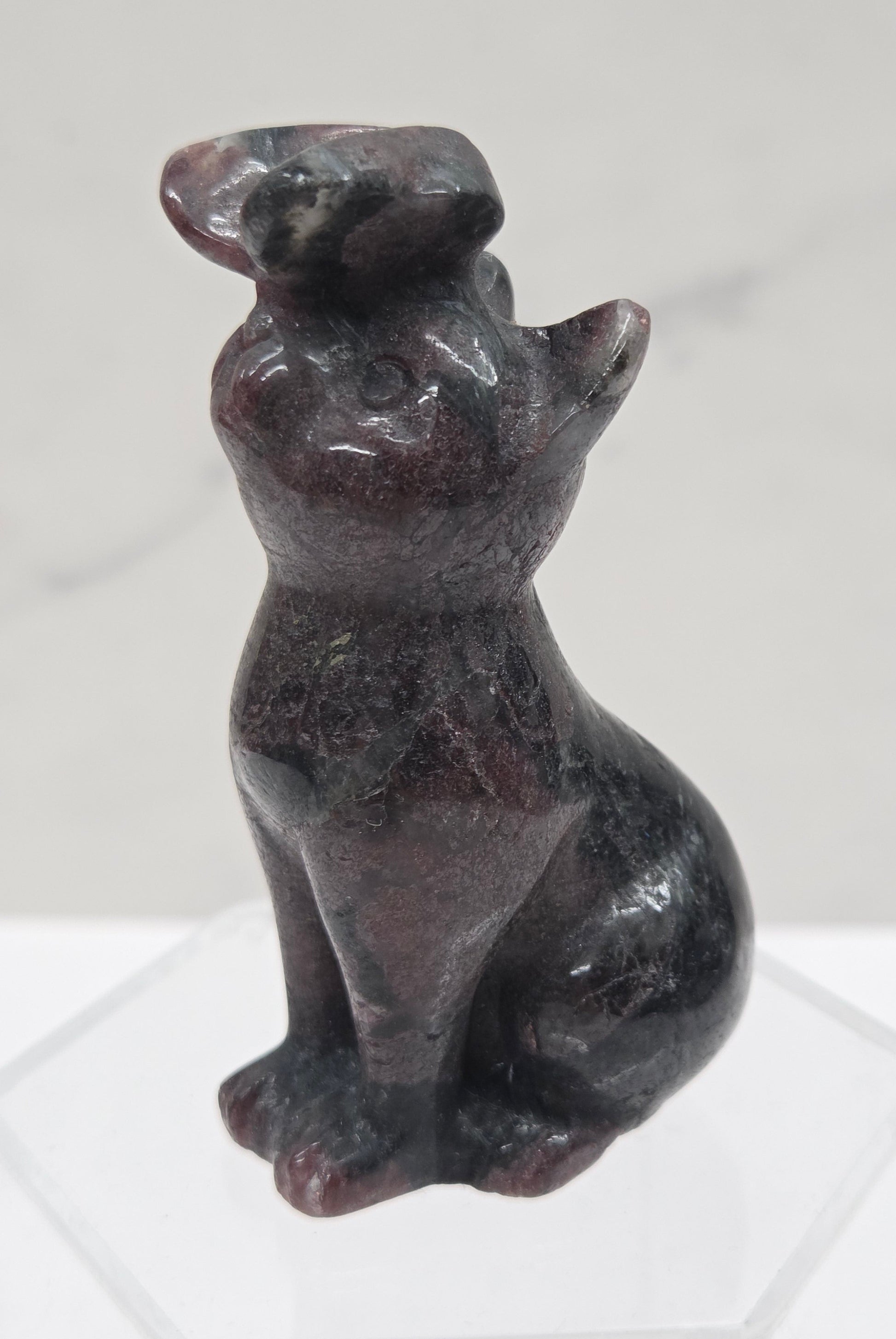 Garnet crystal cat-shaped carving with a butterfly on the nose.