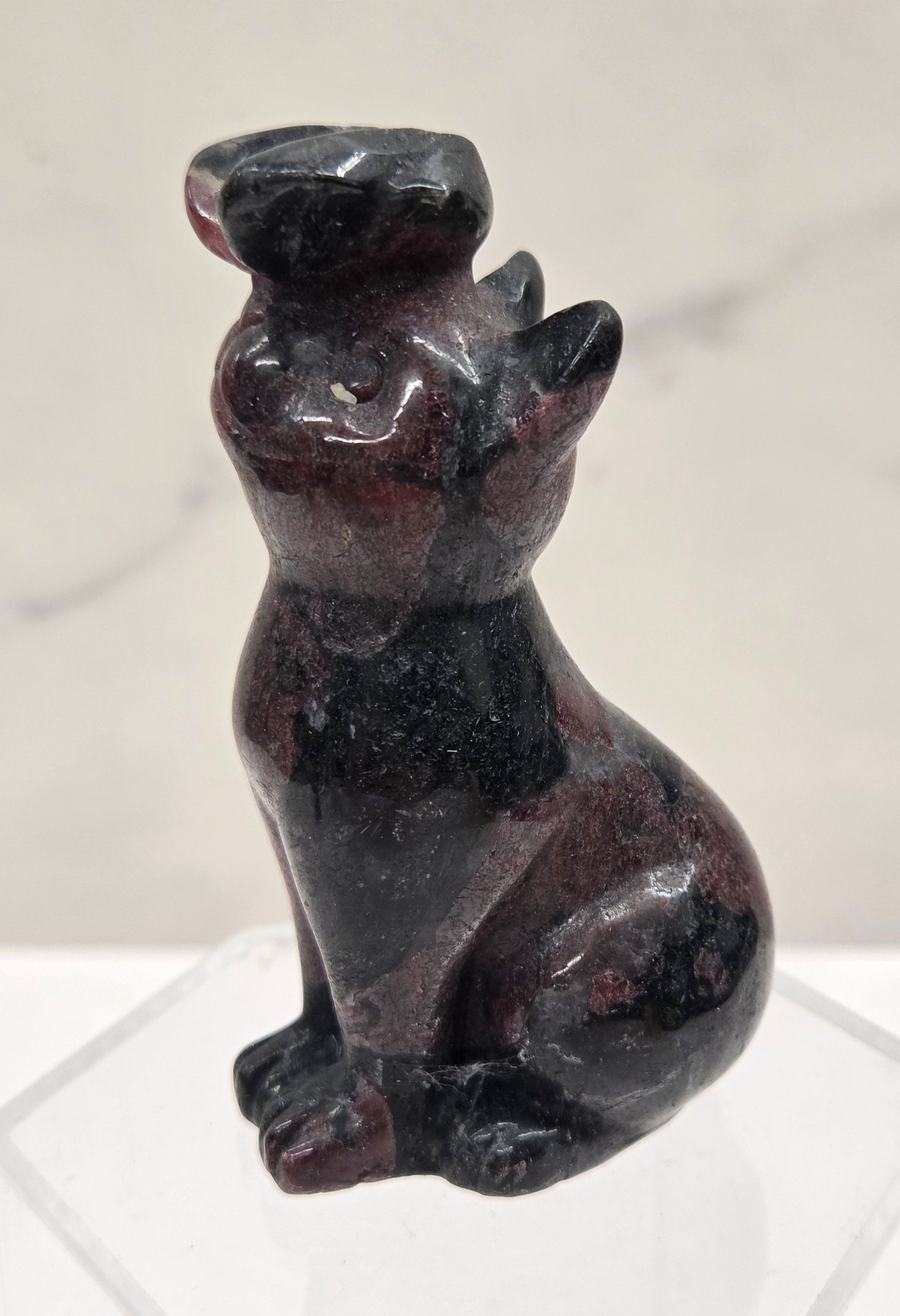 Garnet crystal cat-shaped carving with a butterfly on the nose.