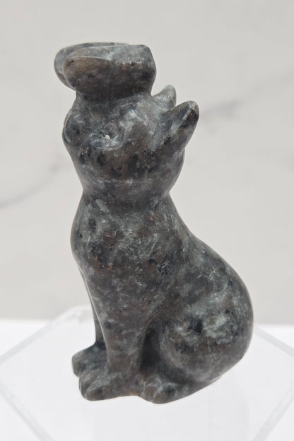 Yooperlite crystal cat-shaped carving with a butterfly on the nose.