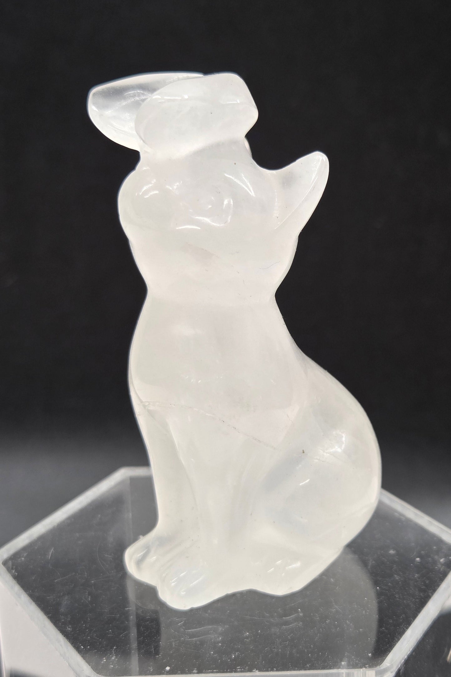 Rose Quartz crystal cat-shaped carving with a butterfly on the nose.