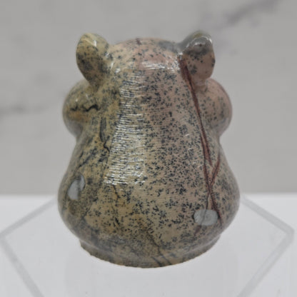 Picture Jasper carving of a chipmunk on an acrylic block against a white background