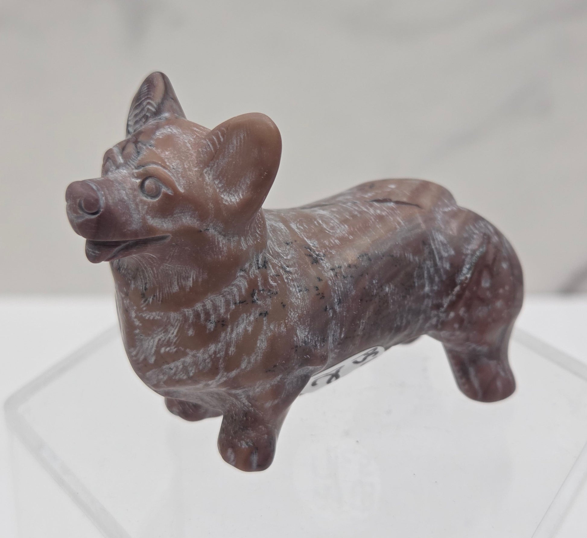 Decorative crystal Corgi dog carving on a white background