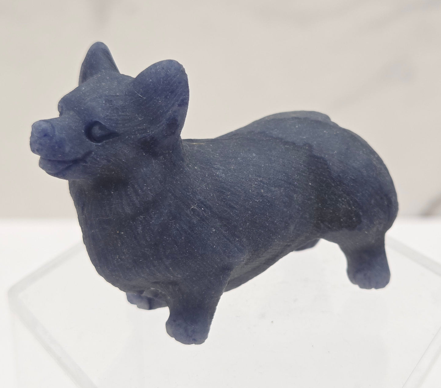 Decorative crystal Corgi dog carving on a white background