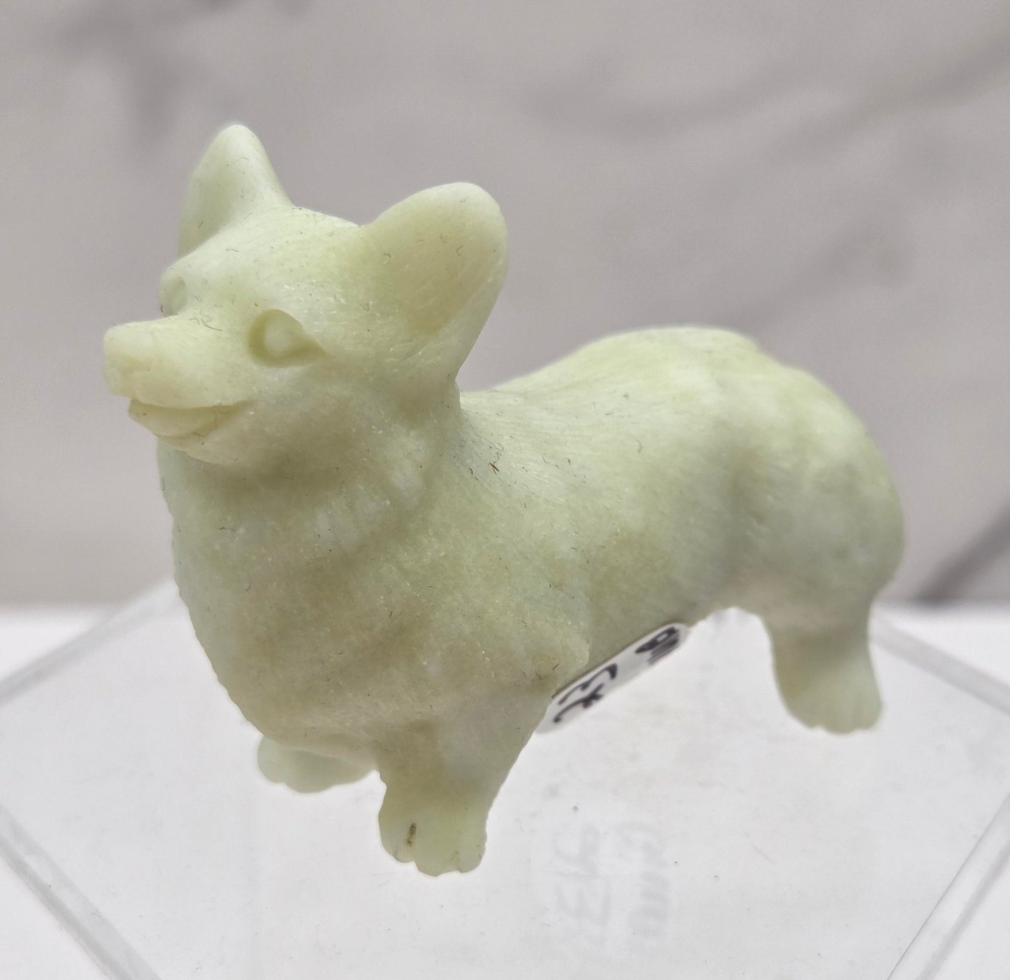 Decorative crystal Corgi dog carving on a white background