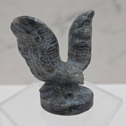 Decorative stone eagle figure on a white background