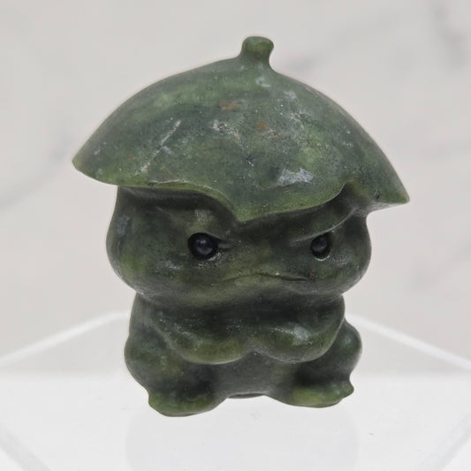 Green jade sculpture on a white background