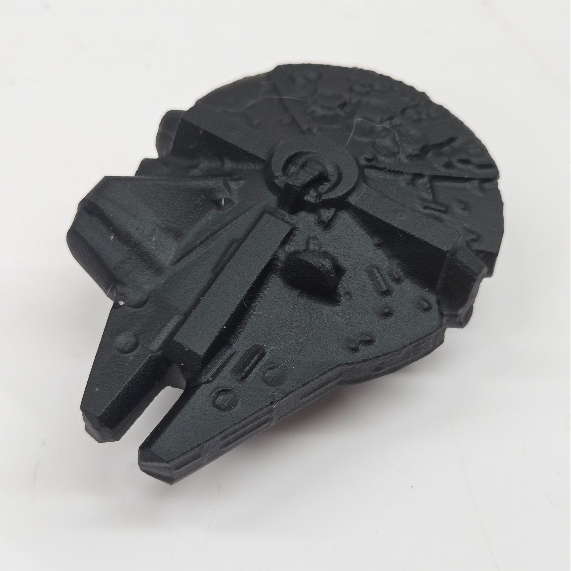 Black obsidian of a millennium spaceship on a white background