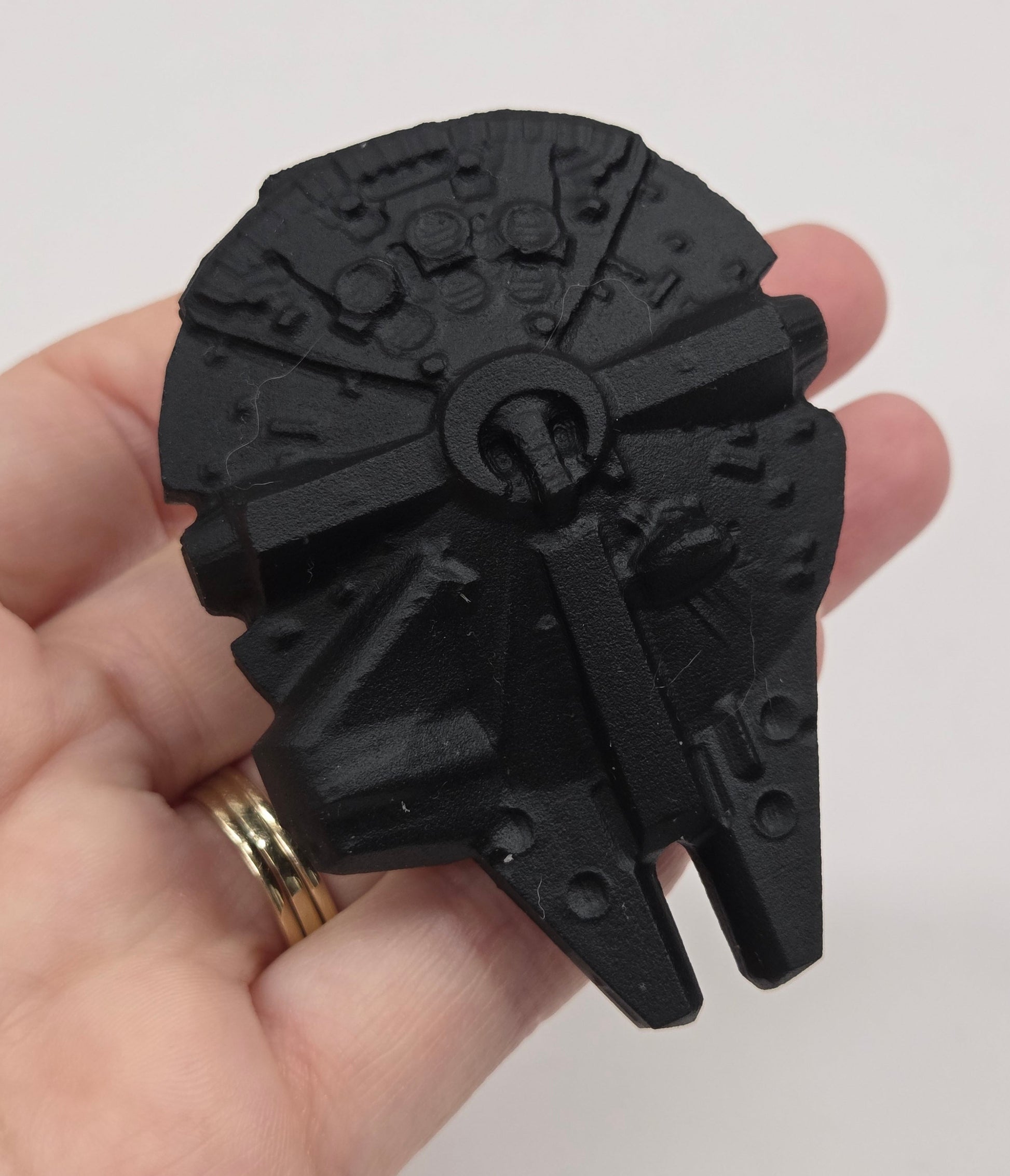 Black obsidian of a millennium spaceship on a white background