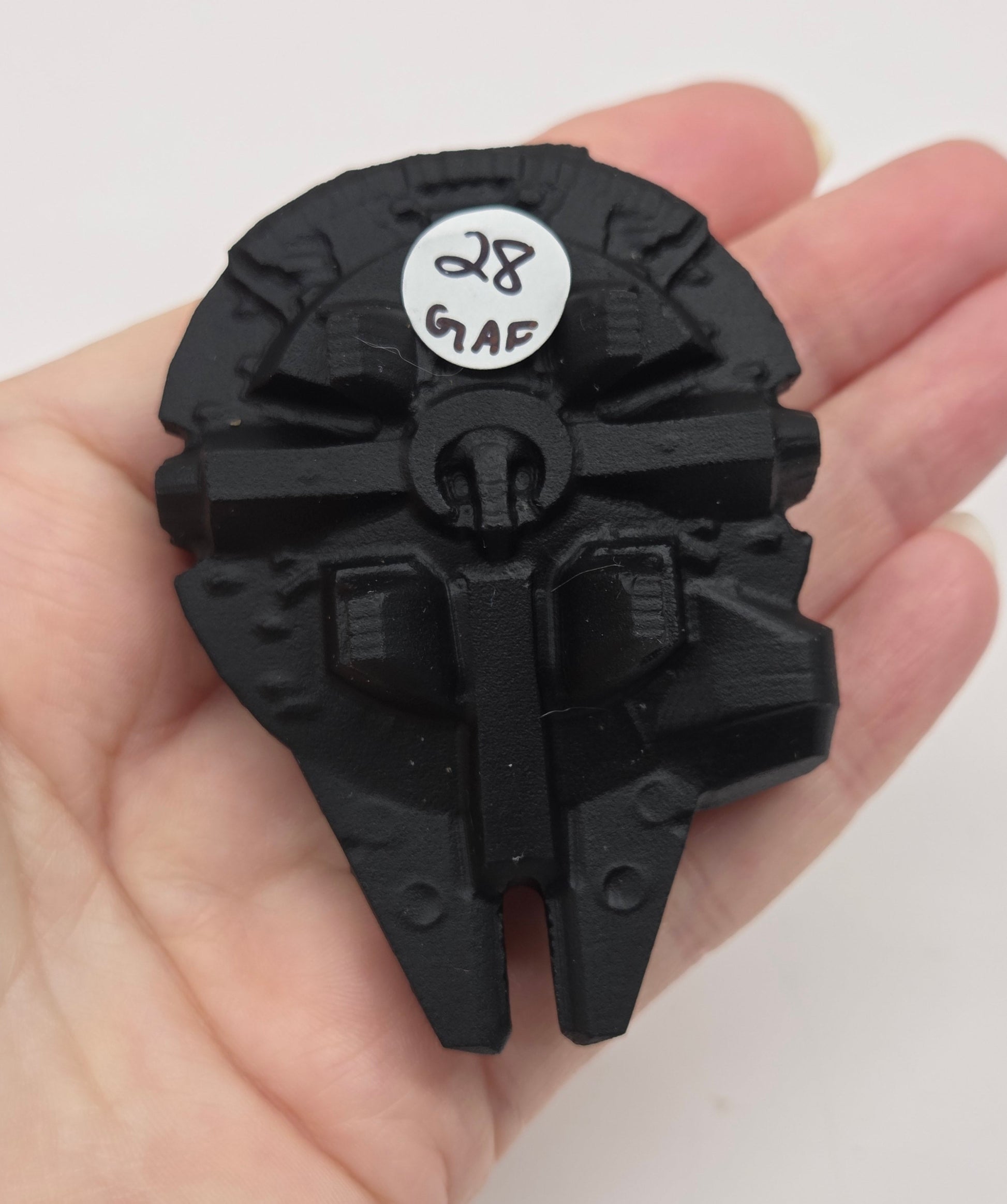 Black obsidian of a millennium spaceship on a white background