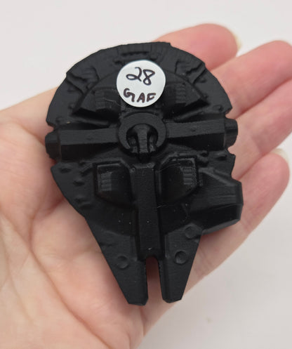 Black obsidian of a millennium spaceship on a white background