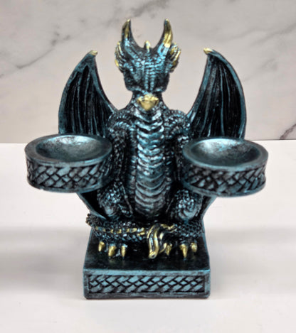 Decorative dragon-shaped sphere holder on a marble surface