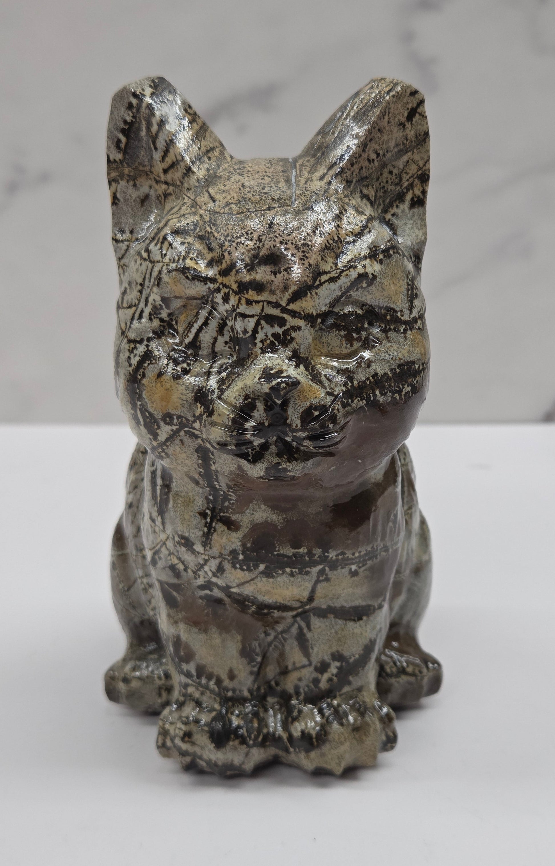Decorative Picture Jasper cat carving on a white background