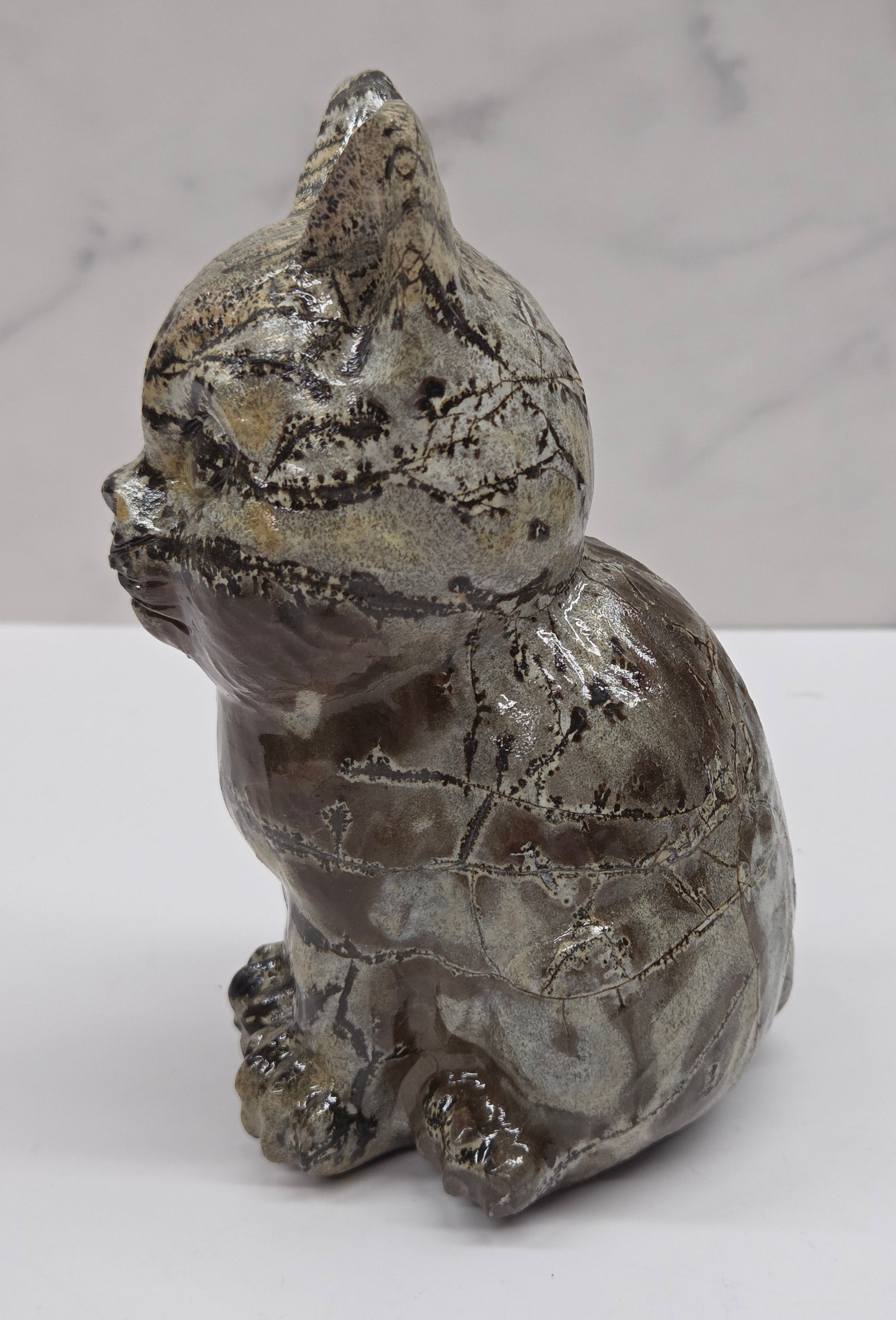 Decorative Picture Jasper cat carving on a white background
