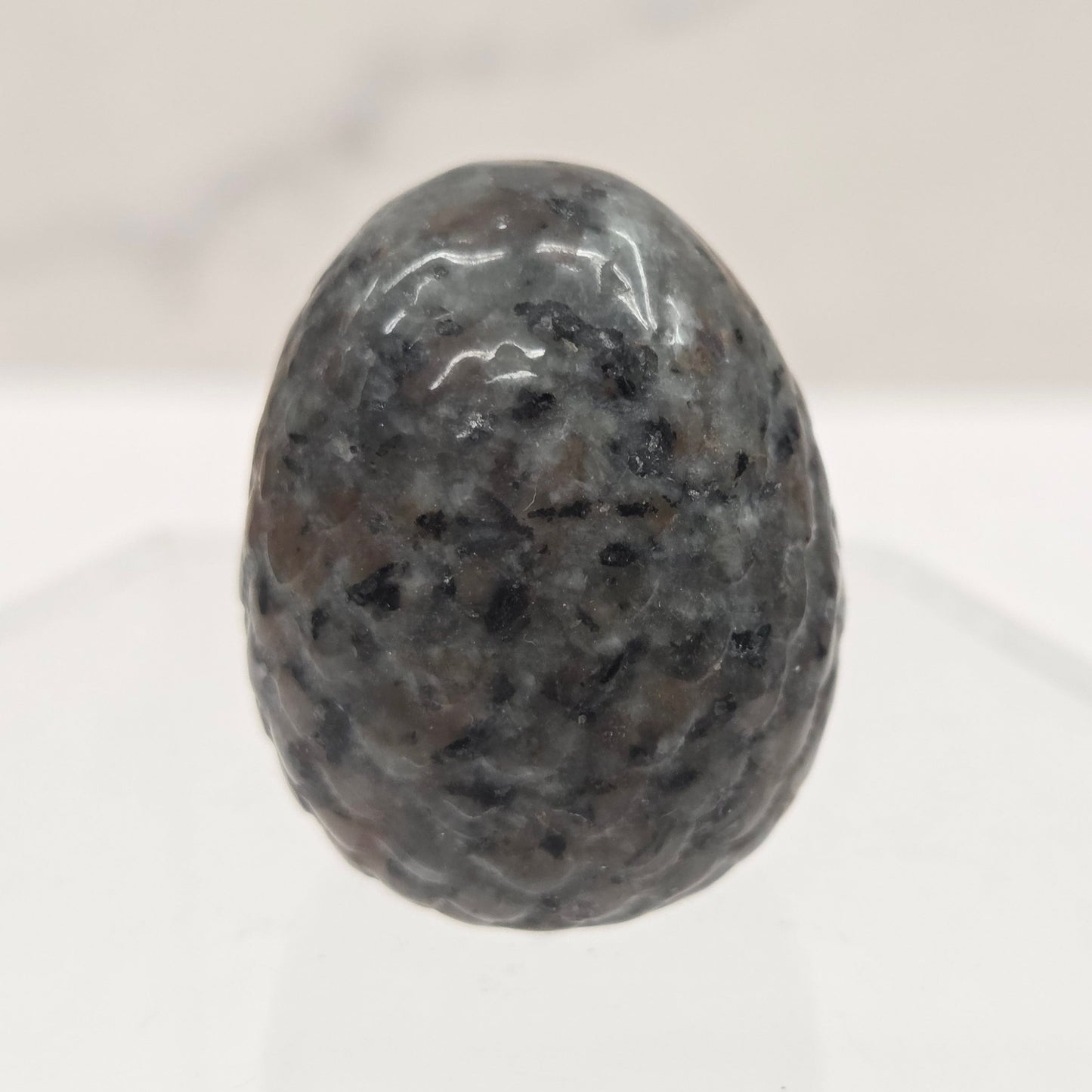 Polished gray stone on a white background