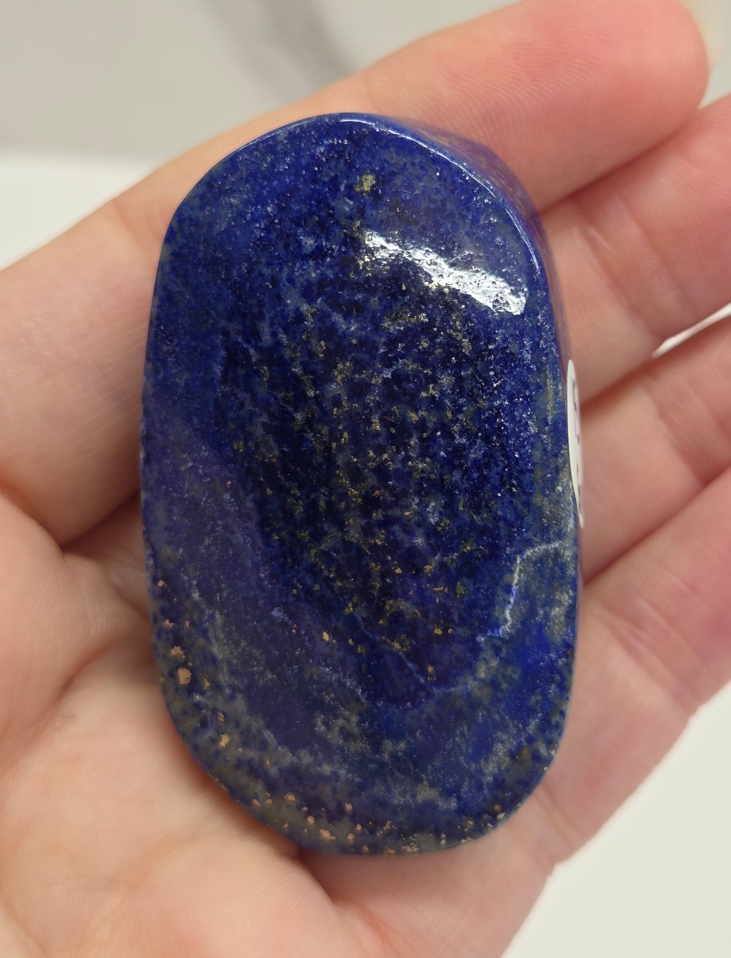 Lapis Lazuli polished palm with white, grey and blue coloring