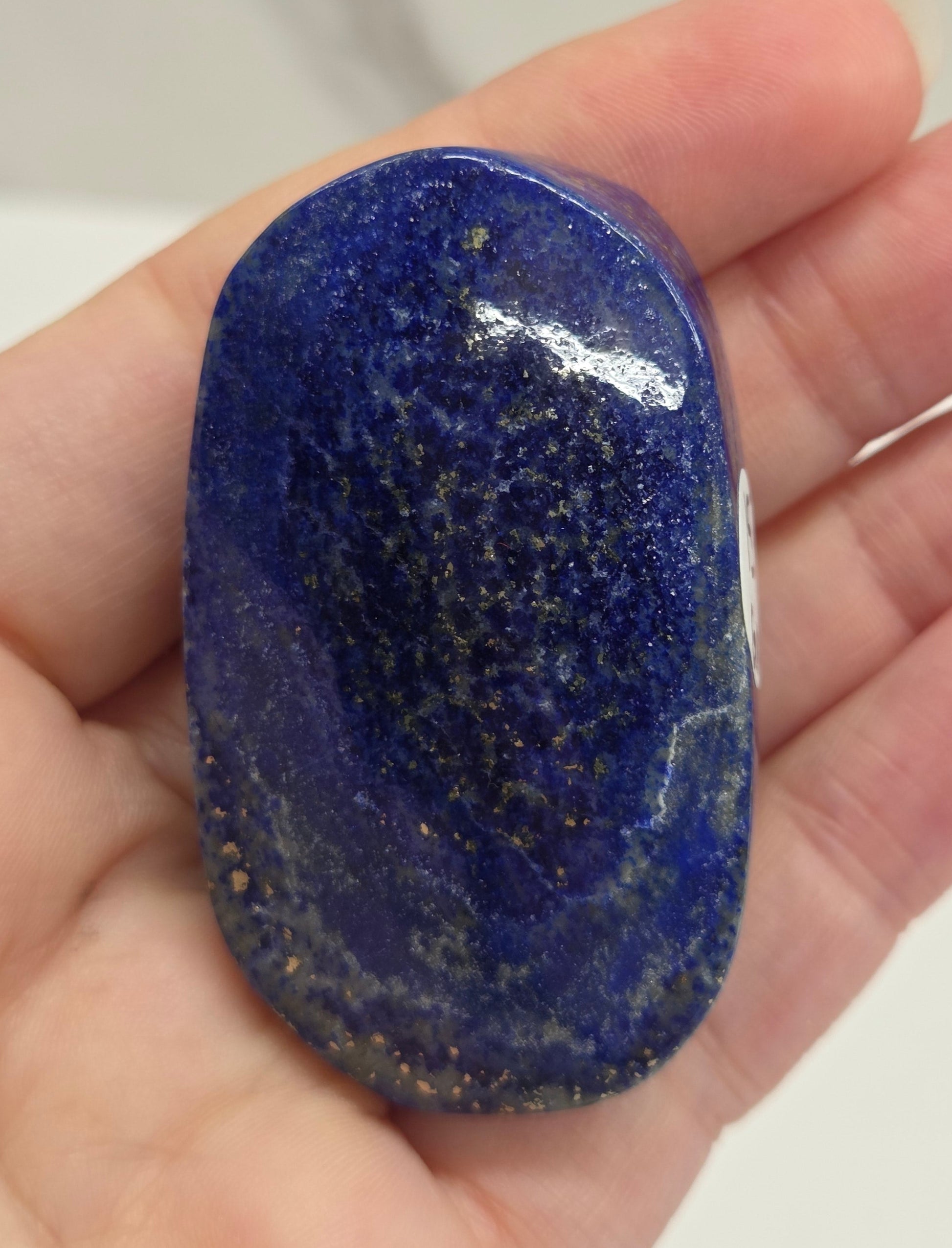 Lapis Lazuli polished palm with white, grey and blue coloring