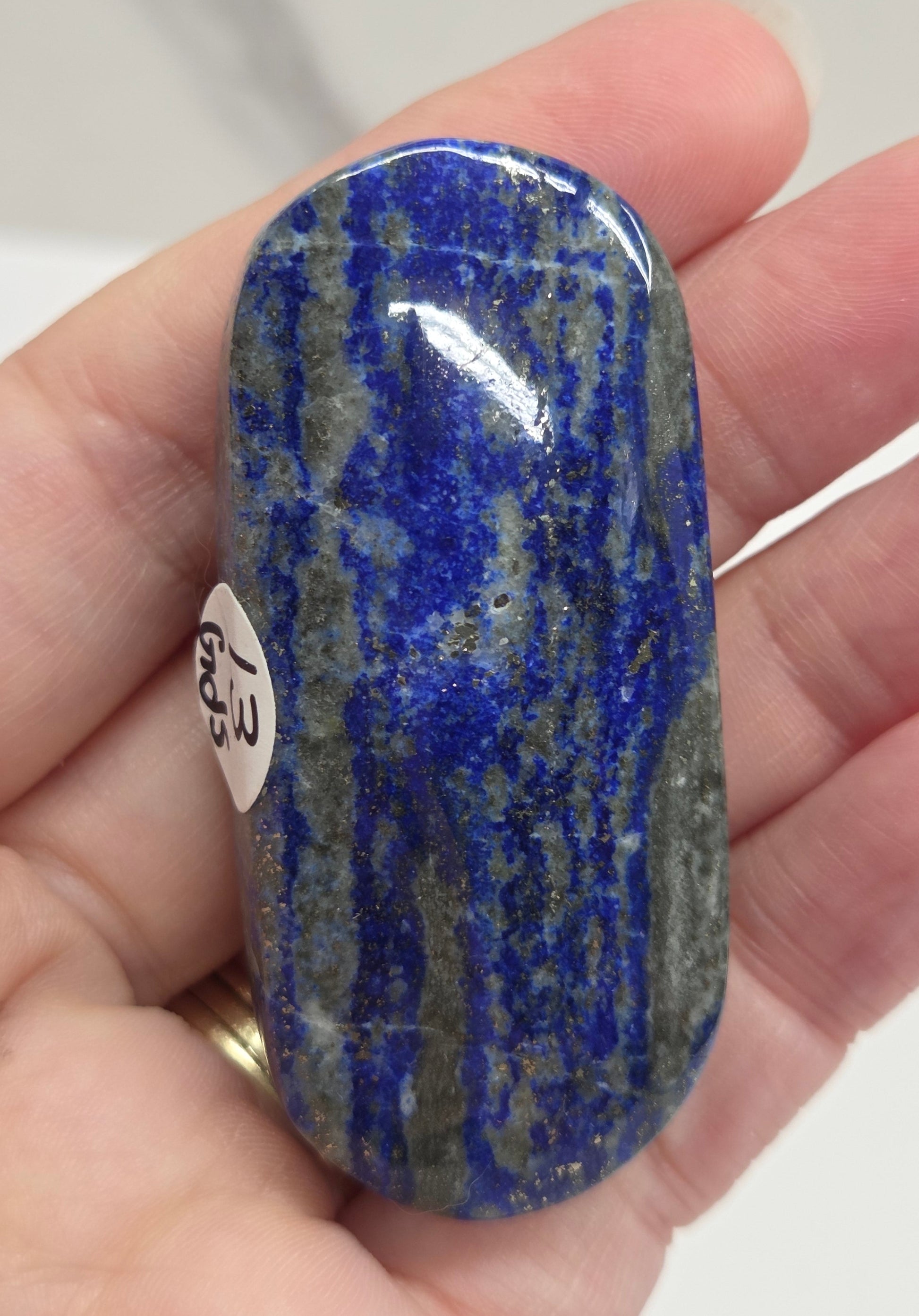 Lapis Lazuli polished palm with white, grey and blue coloring