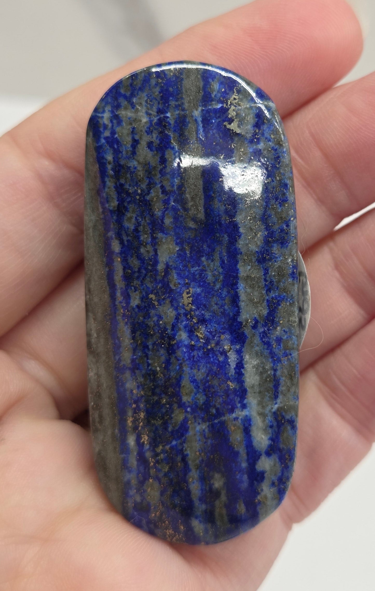 Lapis Lazuli polished palm with white, grey and blue coloring