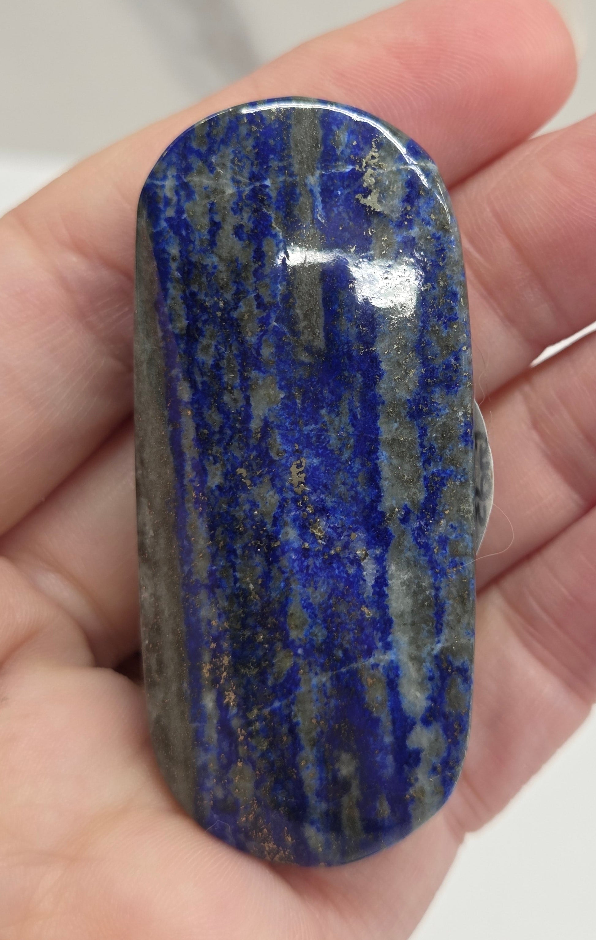 Lapis Lazuli polished palm with white, grey and blue coloring