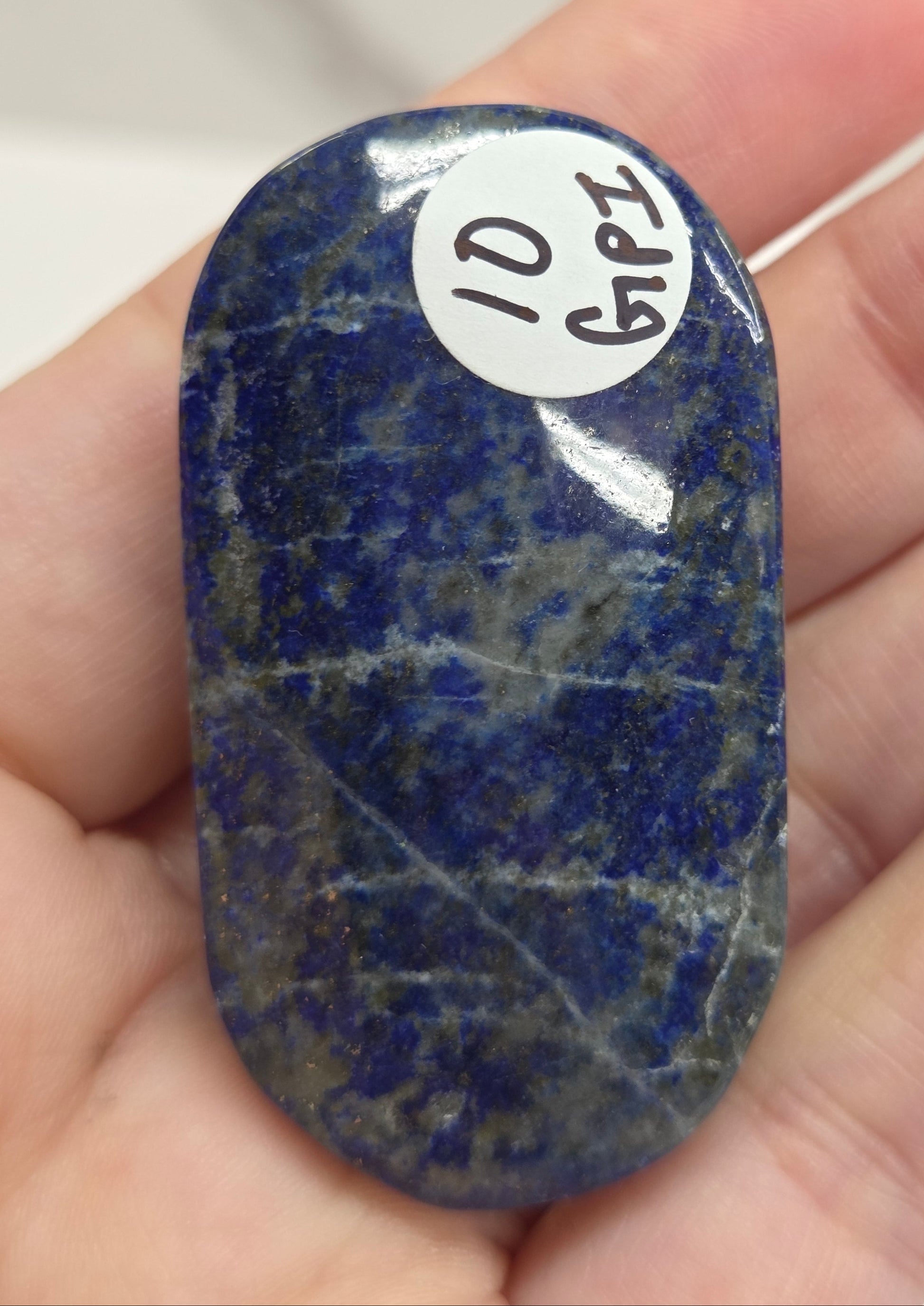 Lapis Lazuli polished palm with white, grey and blue coloring