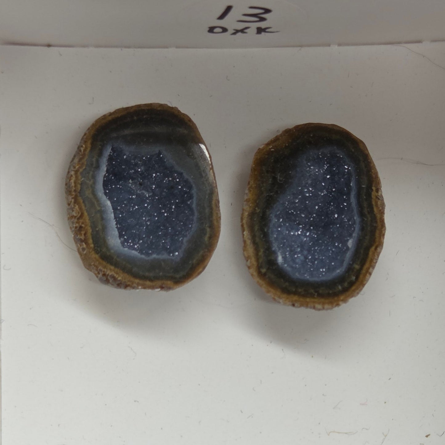Set of geode crystals in a small white box