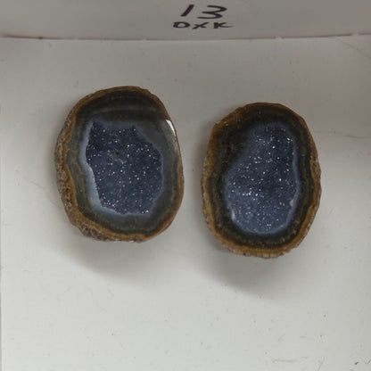 Set of geode crystals in a small white box