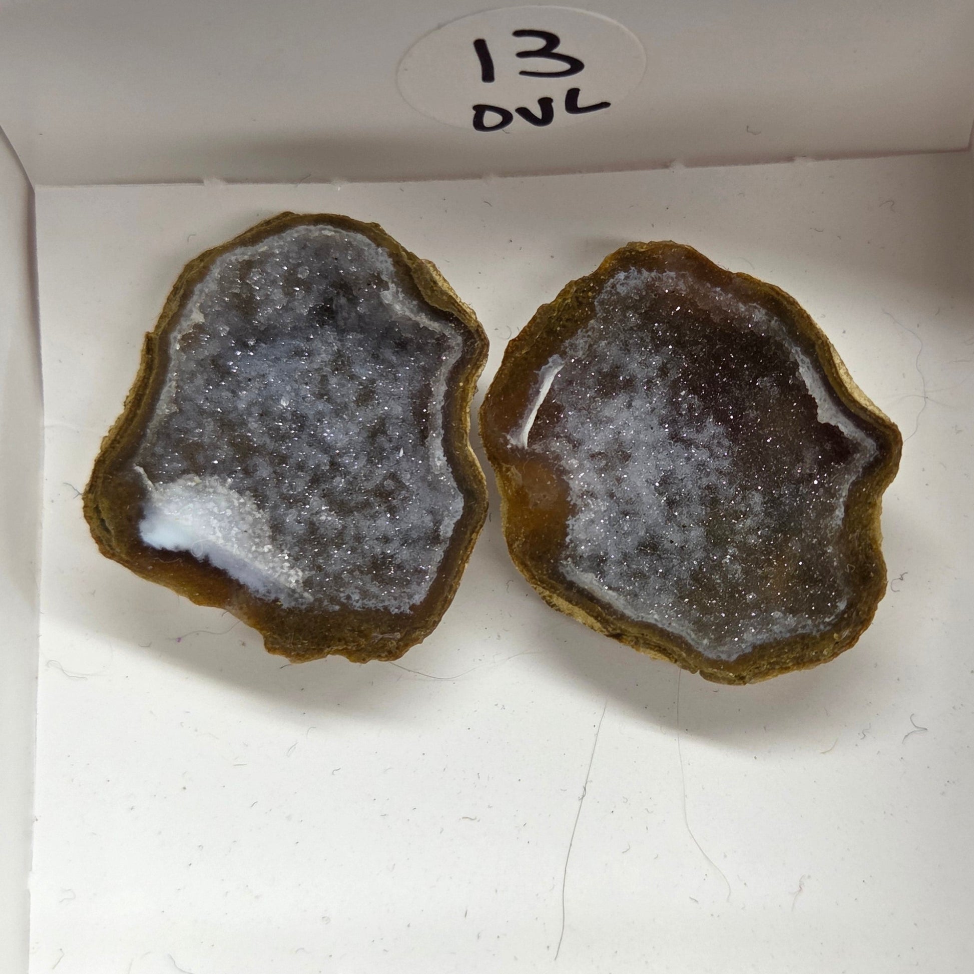 Set of geode crystals in a small white box
